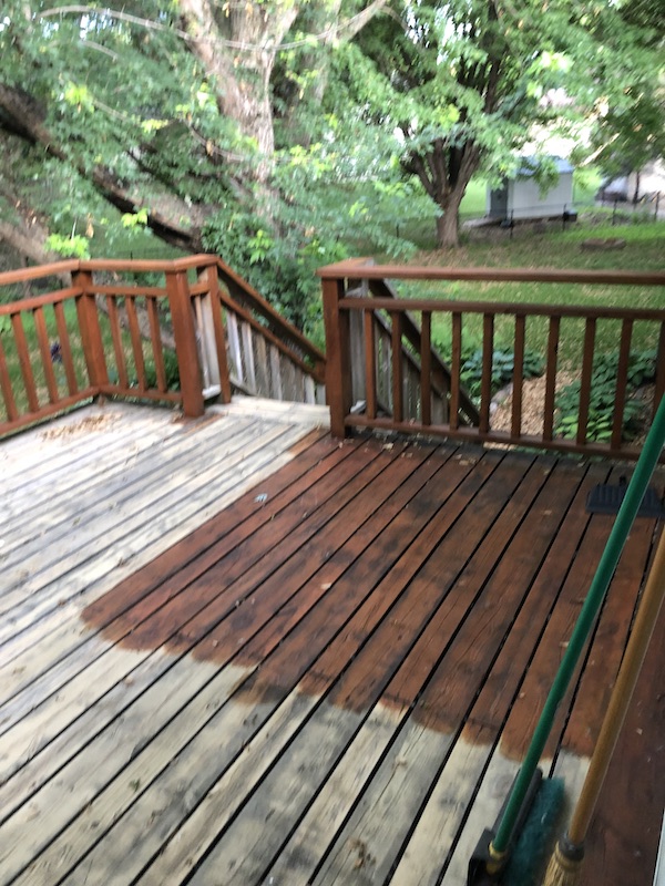 view of right side of deck with stain.