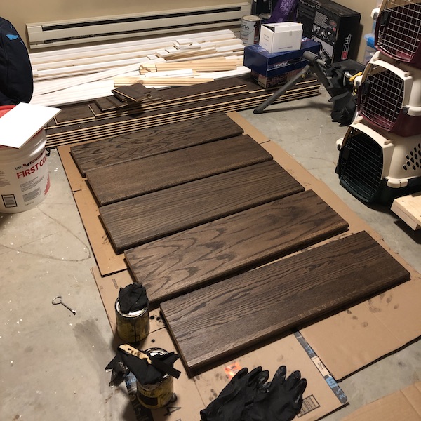 Staining the basement stairs.