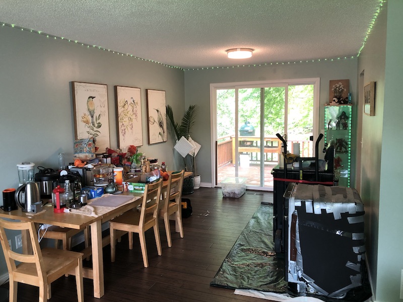 Dining room full of kitchen stuff.