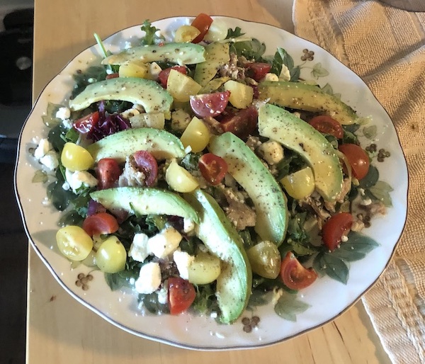 Dinner salad, with feta, tomato, avocado, & flaked sardine