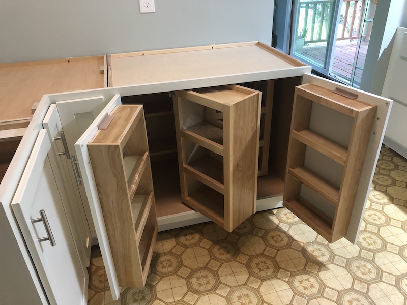 Double door cabinet with pantry swing outs