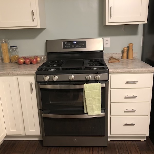 New gas range with double ovens.